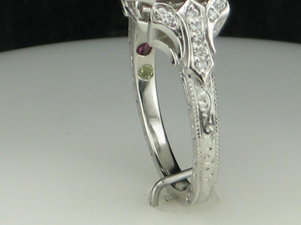PoKxlURbTHePl7x90eh1_Engagement-ring-with-inlaid-birthstones-for-family-members-via-CustomMade.jpeg