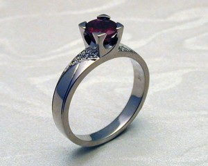 Contemporary Art Deco Style Engagement Ring with Ruby in 4-Claw Fishtail Setting and Pave Set Diamonds by Metamorphosis Jewellery Workshop at CustomMade.com