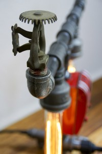 Reclaim, Reverse, Resurrect: Fire Sprinkler Lamp Side View Photograph