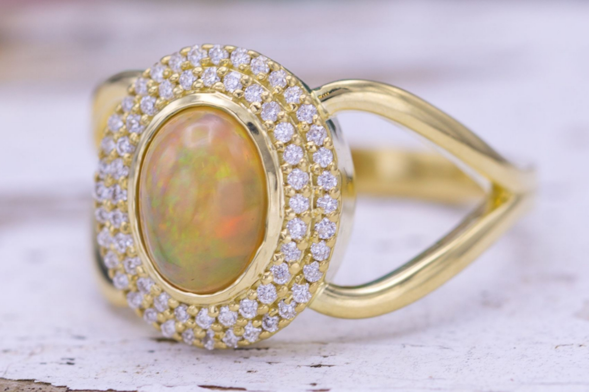 Double halo engagement ring with yellow opal and diamonds