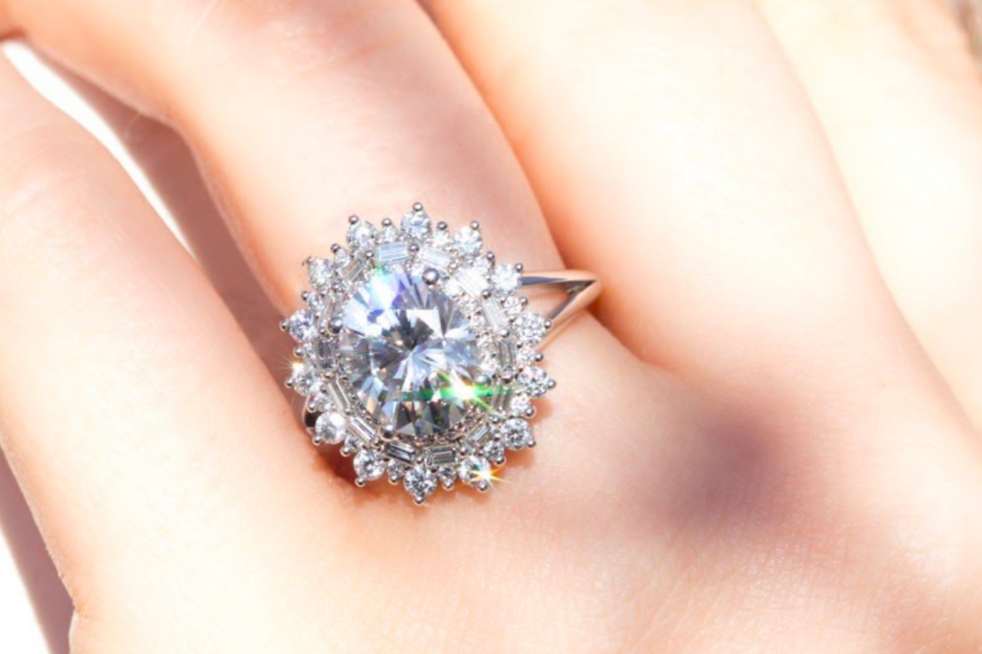Glamorous engagement ring with triple sunburst halo