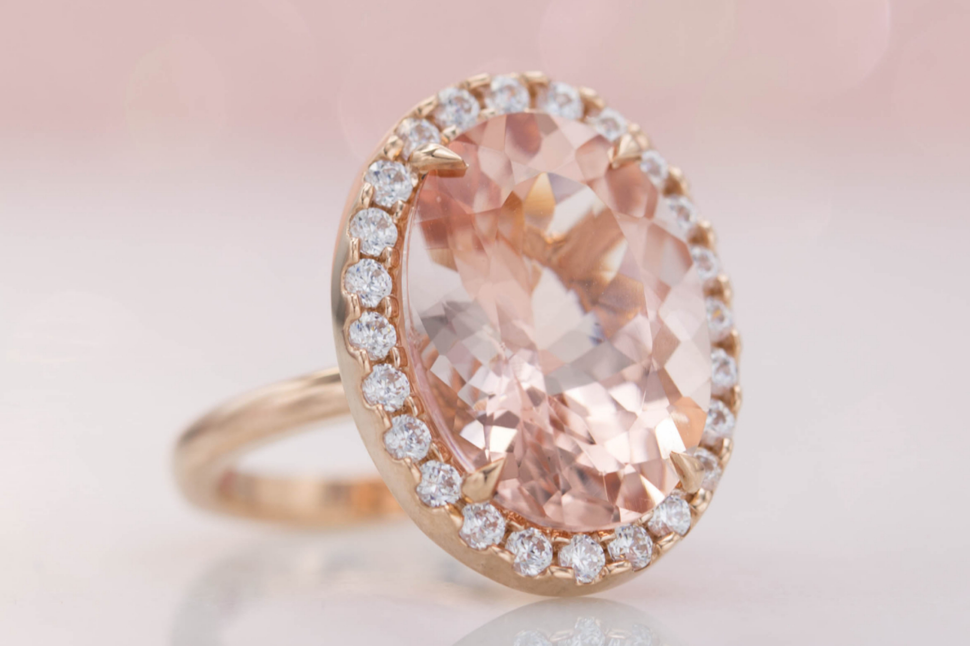 Halo engagement ring with huge oval morganite center stone