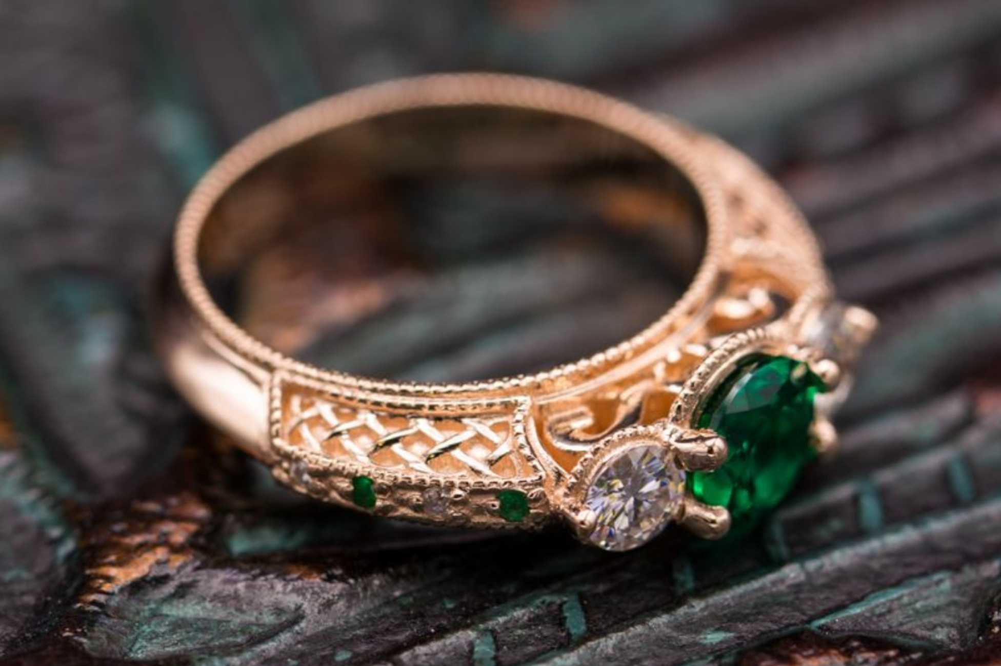 Vintage-inspired rose gold ring with three stone emerald and moissanite setting