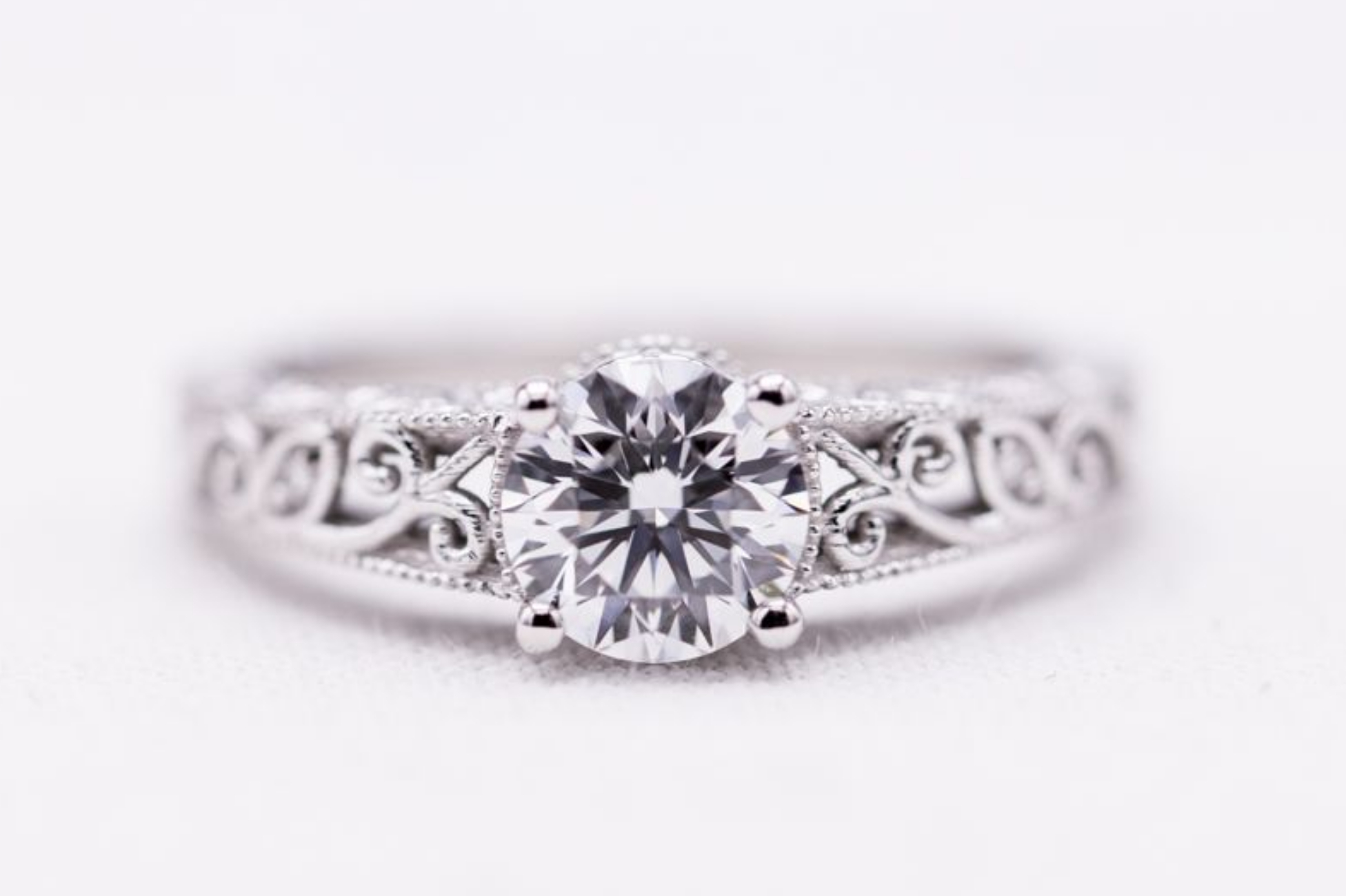Delicate white gold filigree engagement ring with lab created diamond