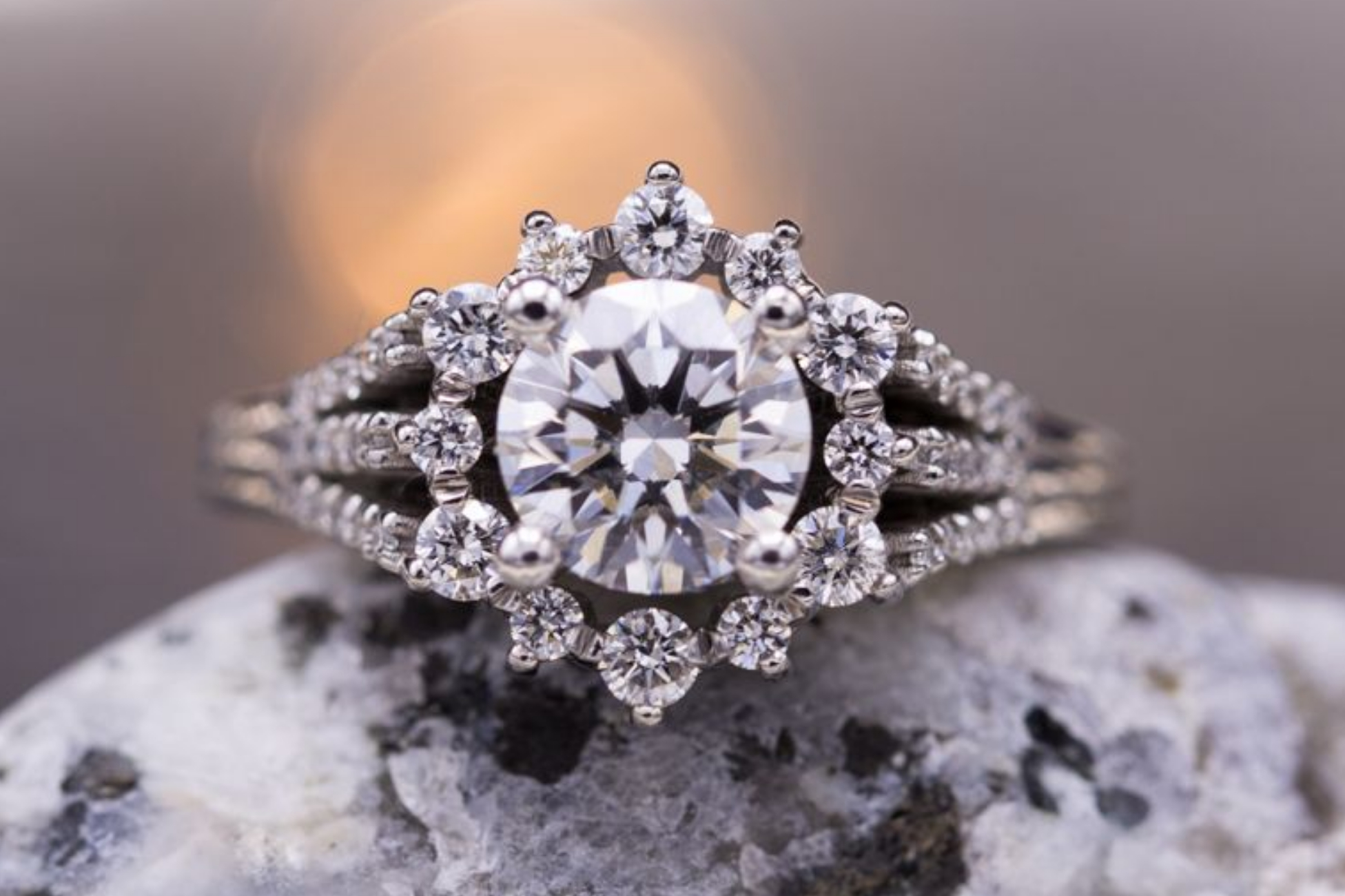 Sunburst halo diamond engagement ring