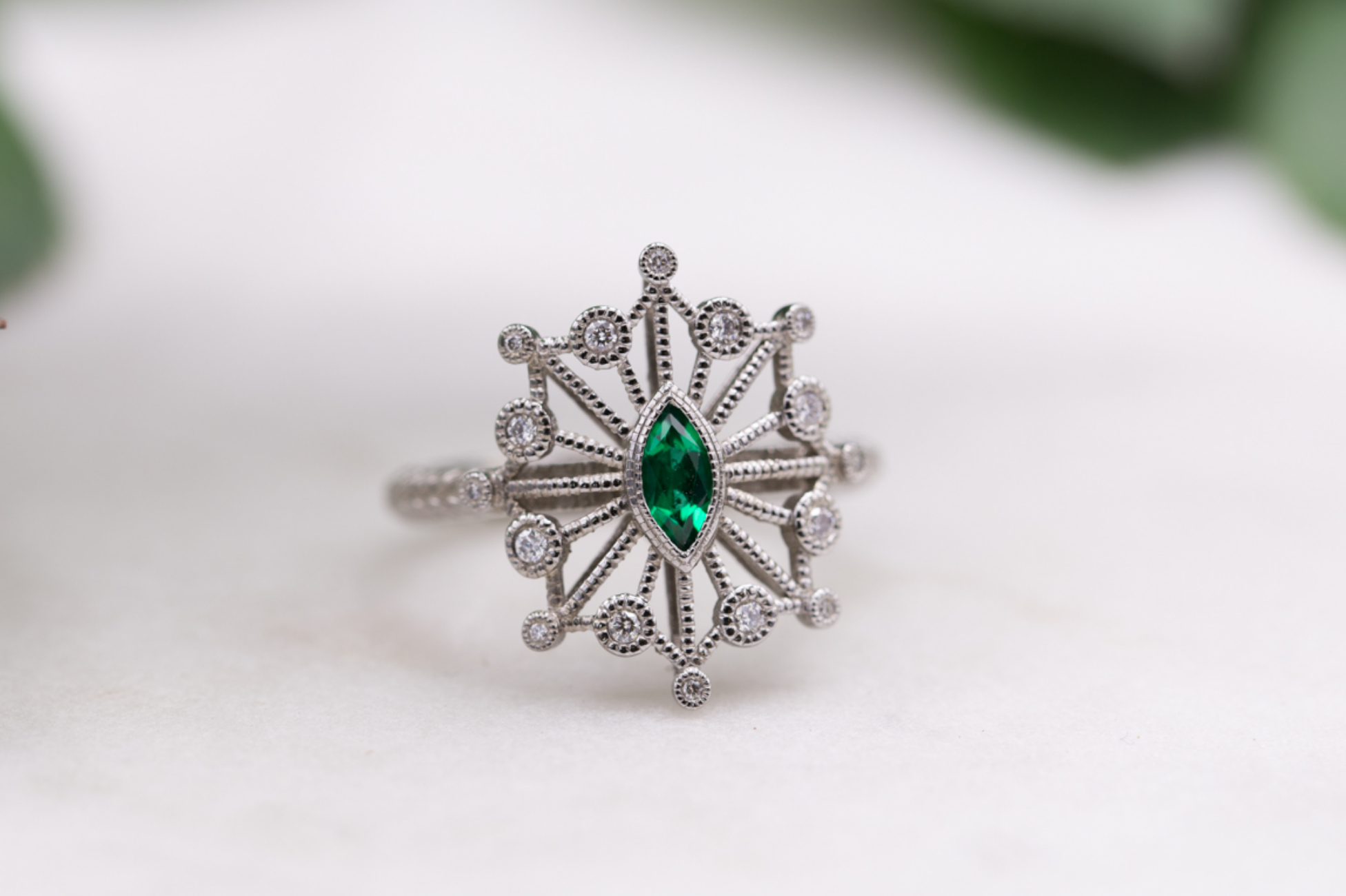 Vintage-inspired snowflake emerald ring