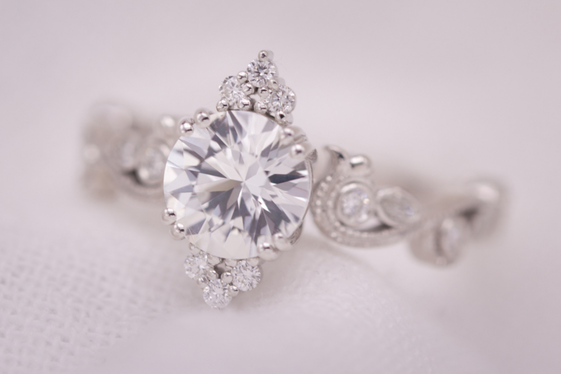 Regal engagement ring with white sapphire