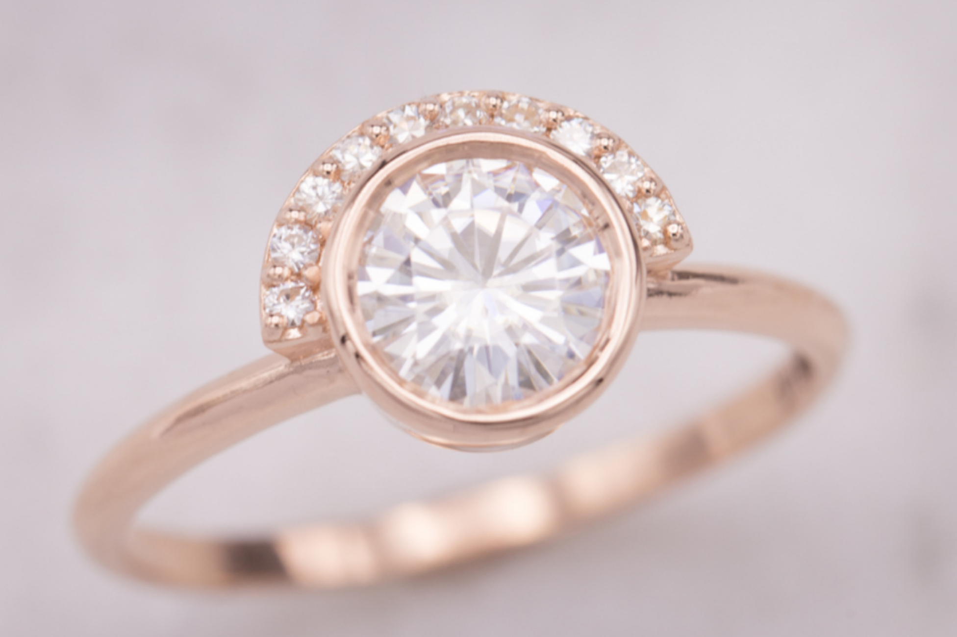 Modern engagement ring with half-halo